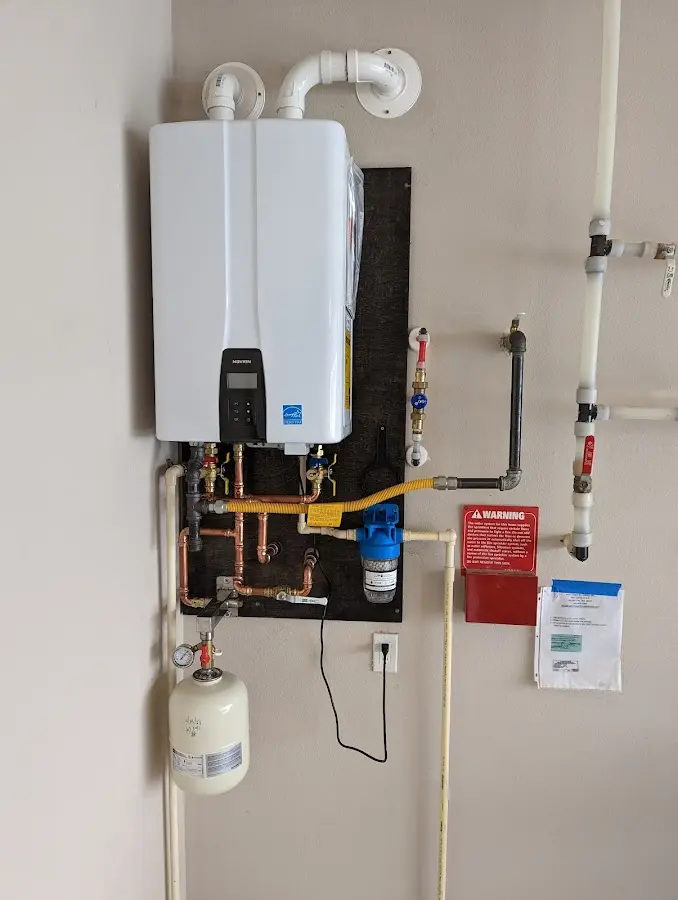 Professional plumber installing copper piping in a Selma home